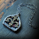 fleur de lis - iridescent aqua arch window amulet - antiqued sterling & bronze